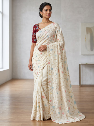 Graceful White Vichitra Silk Saree Adorned With Floral Sequins Embroidery & Golden Arco Border